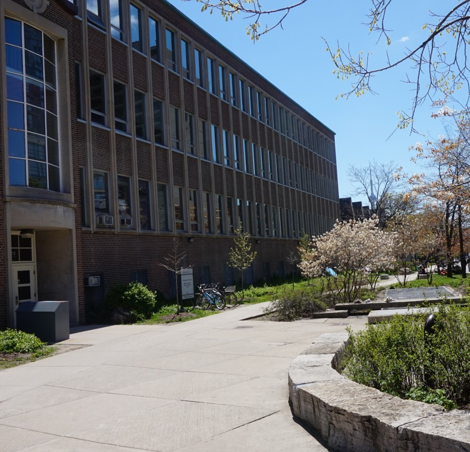 Front of the Sociology building, featuring landscaping and a paved walkway